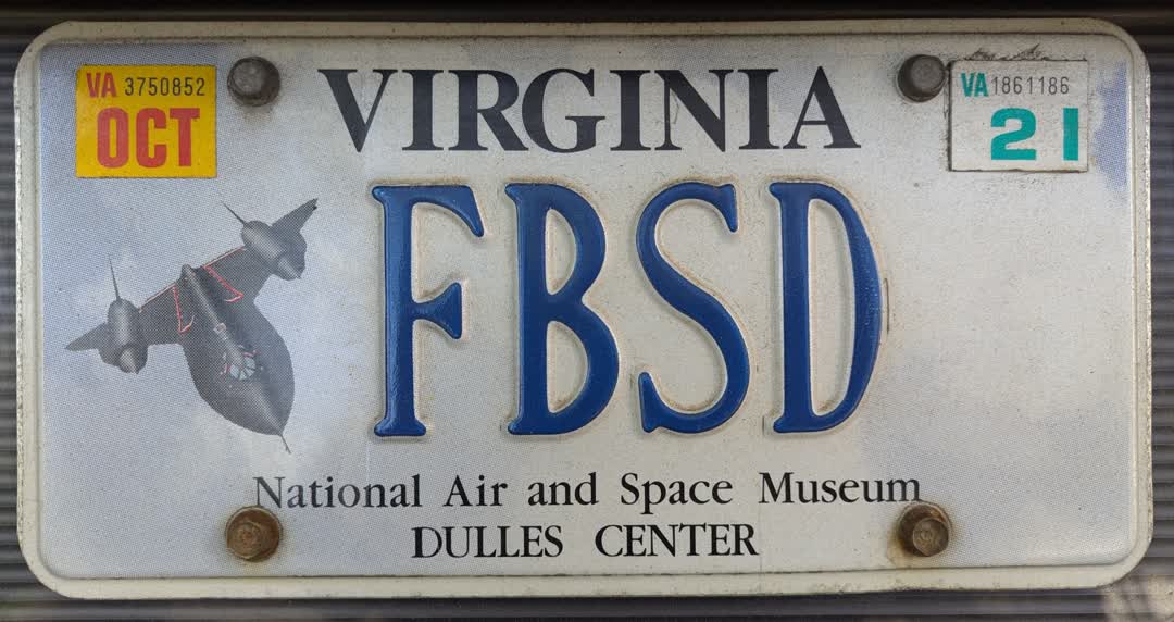 Photograph of a Virginia license plate featuring a SR-71 Blackbird spy plane and the letters FBSD.