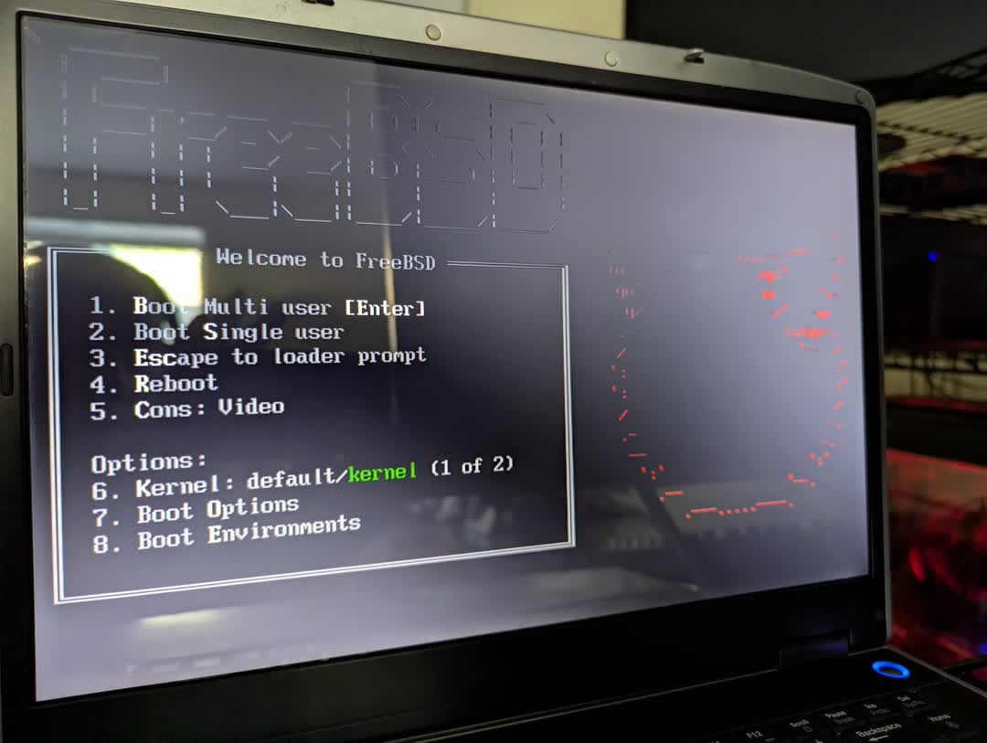 Photograph of the FreeBSD 15 boot menu on a on laptop computer screen