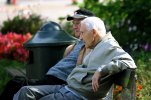 Two_old_men_sitting_on_a_bench_(365432689).jpg